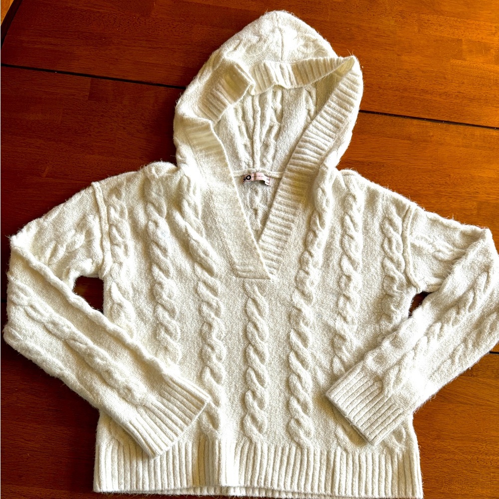 Women’s hooded cable knit sweater